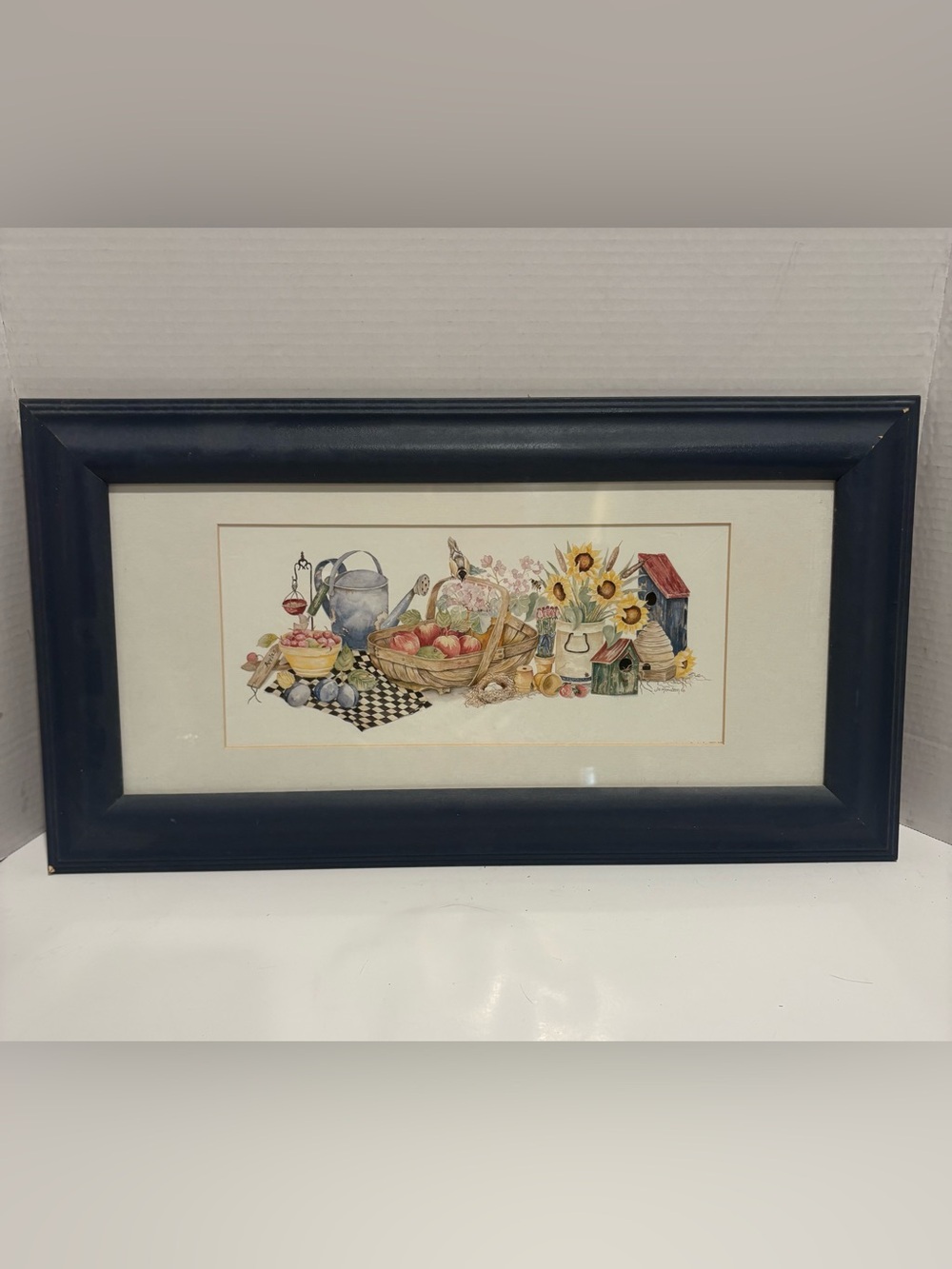 framed print appears to be "Harvest Time" by artist Jo Moulton
